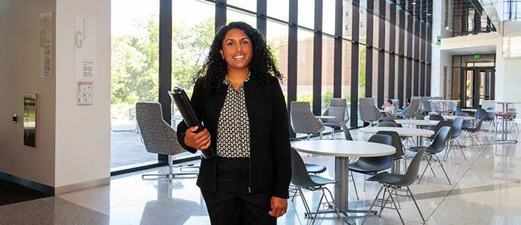 Advisor standing on campus