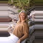 A headshot of Kiara Kapusansky