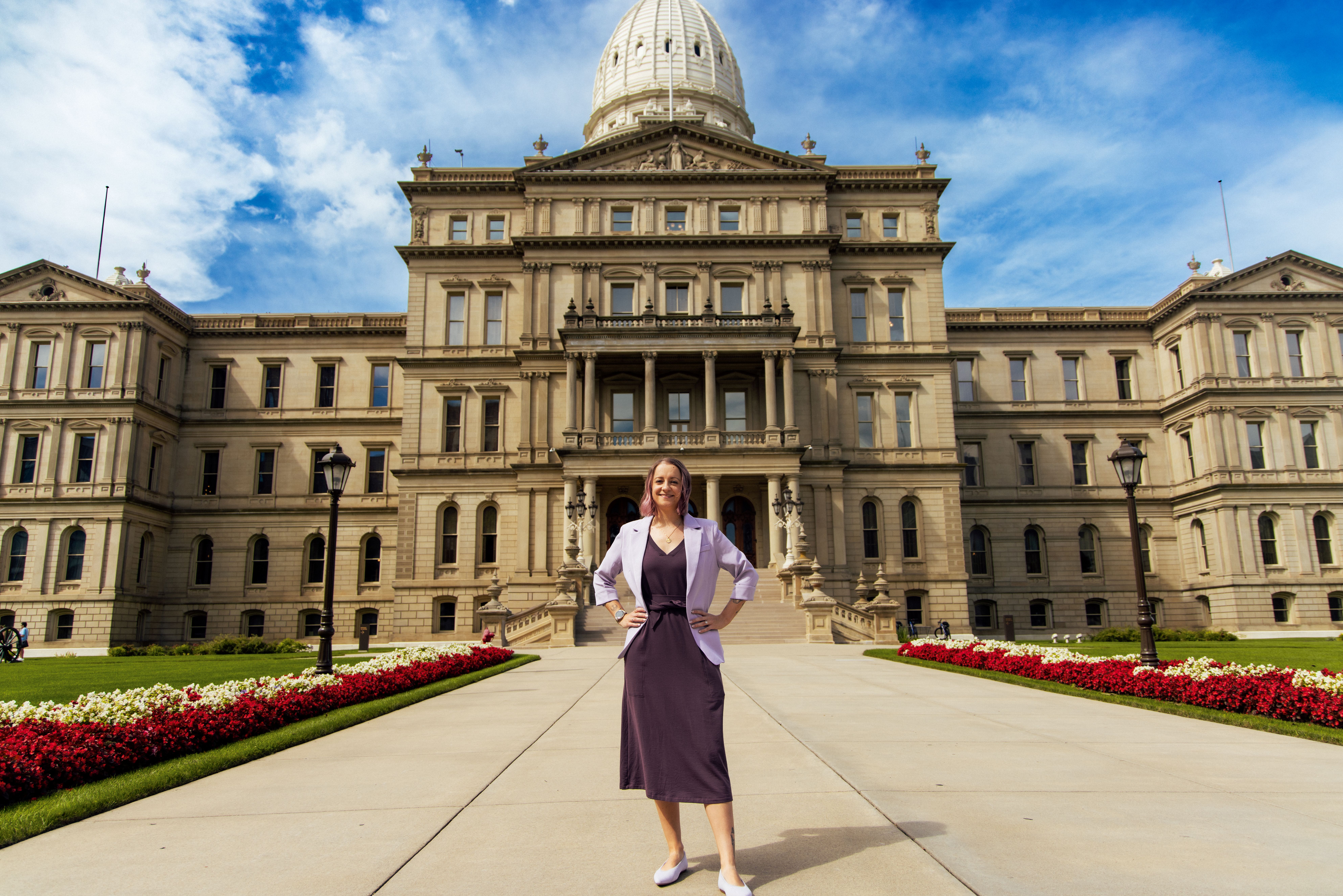 Joana Tolchinsky, Ph.D. standing outside the Michigan State Capitol.