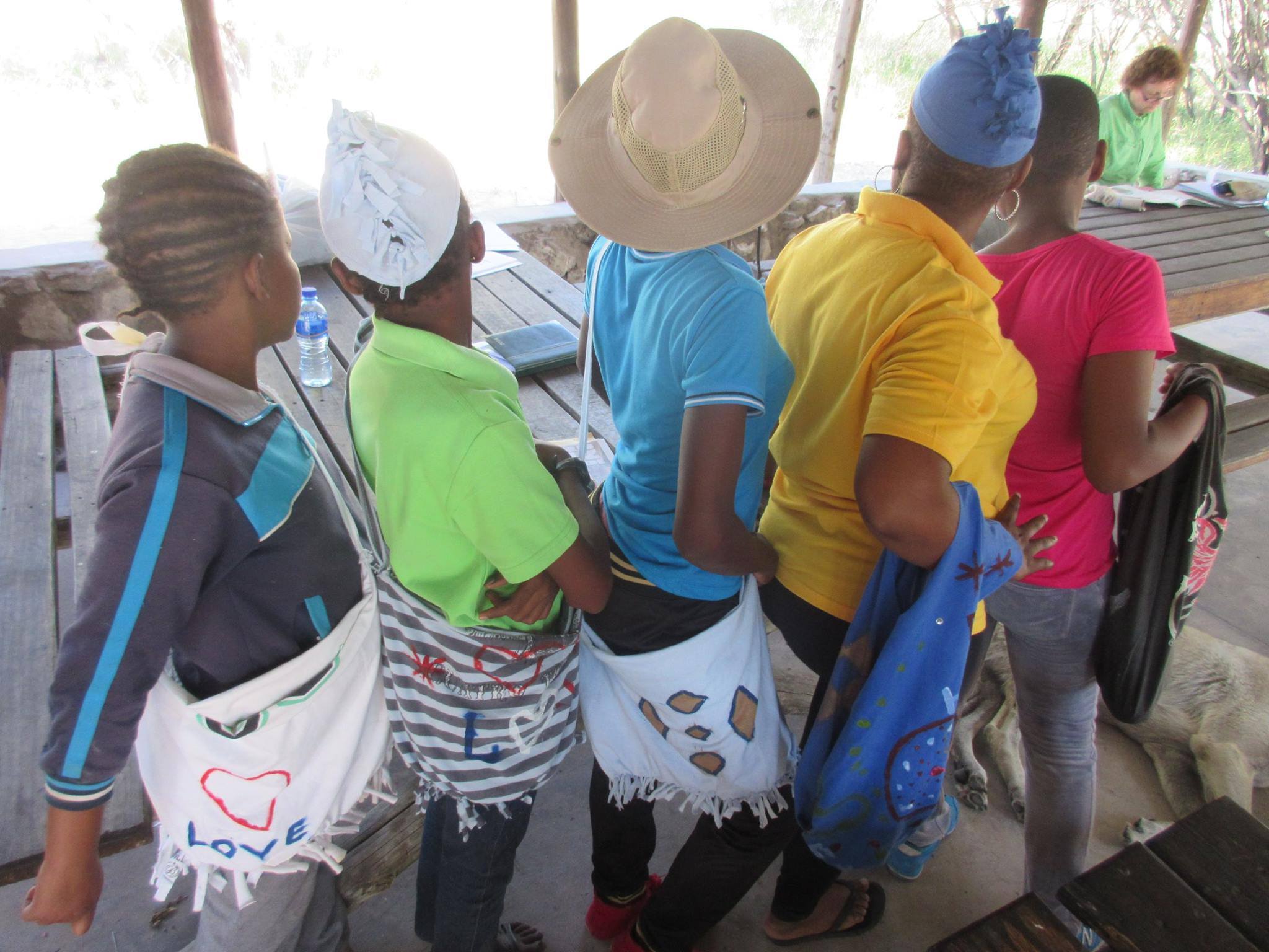 Members of the Ghanzi Teen Club, supporting youth living with HIV, learned about starting a small business and produced bags these from recycled t-shirts